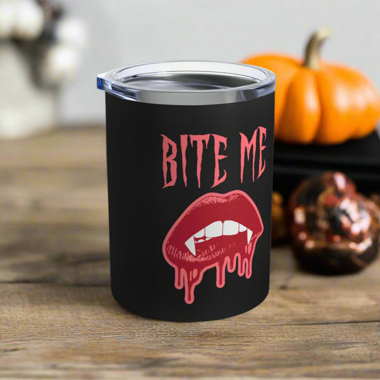 This 10 ounce stainless steel vacuum insulated black travel tumbler features vampire lips and fangs dripping with blood and the words Bite Me in Pink.