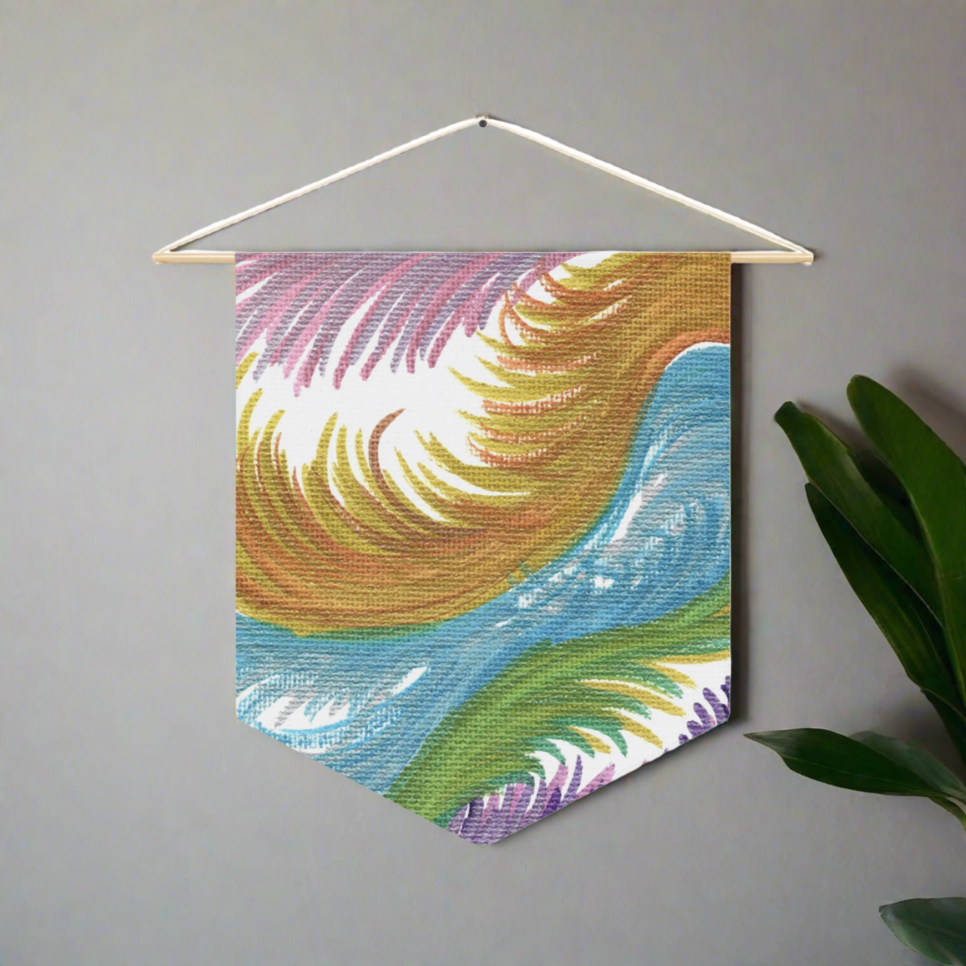 This fabric wall hanging features ethereal space swirls of pinks, blues, greens and gold.