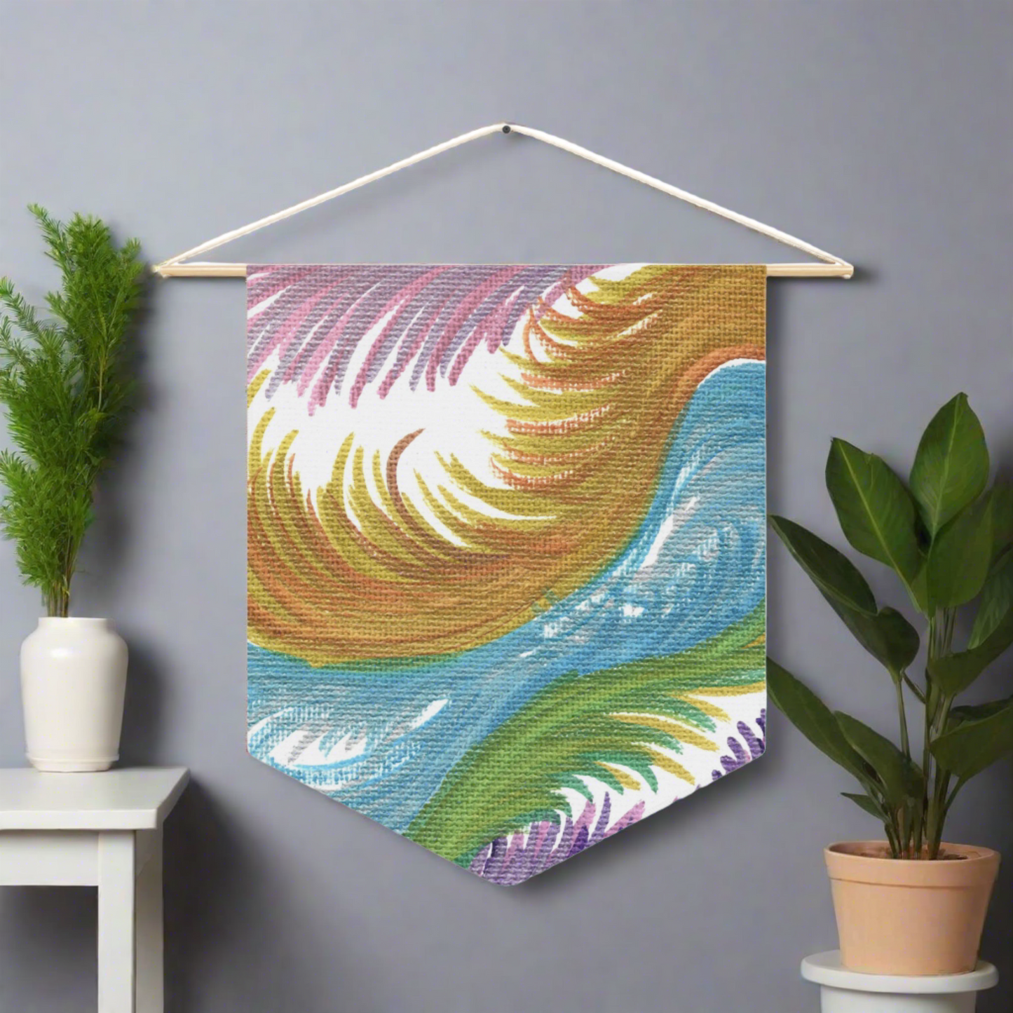 This fabric wall hanging features ethereal space swirls of pinks, blues, greens and gold.