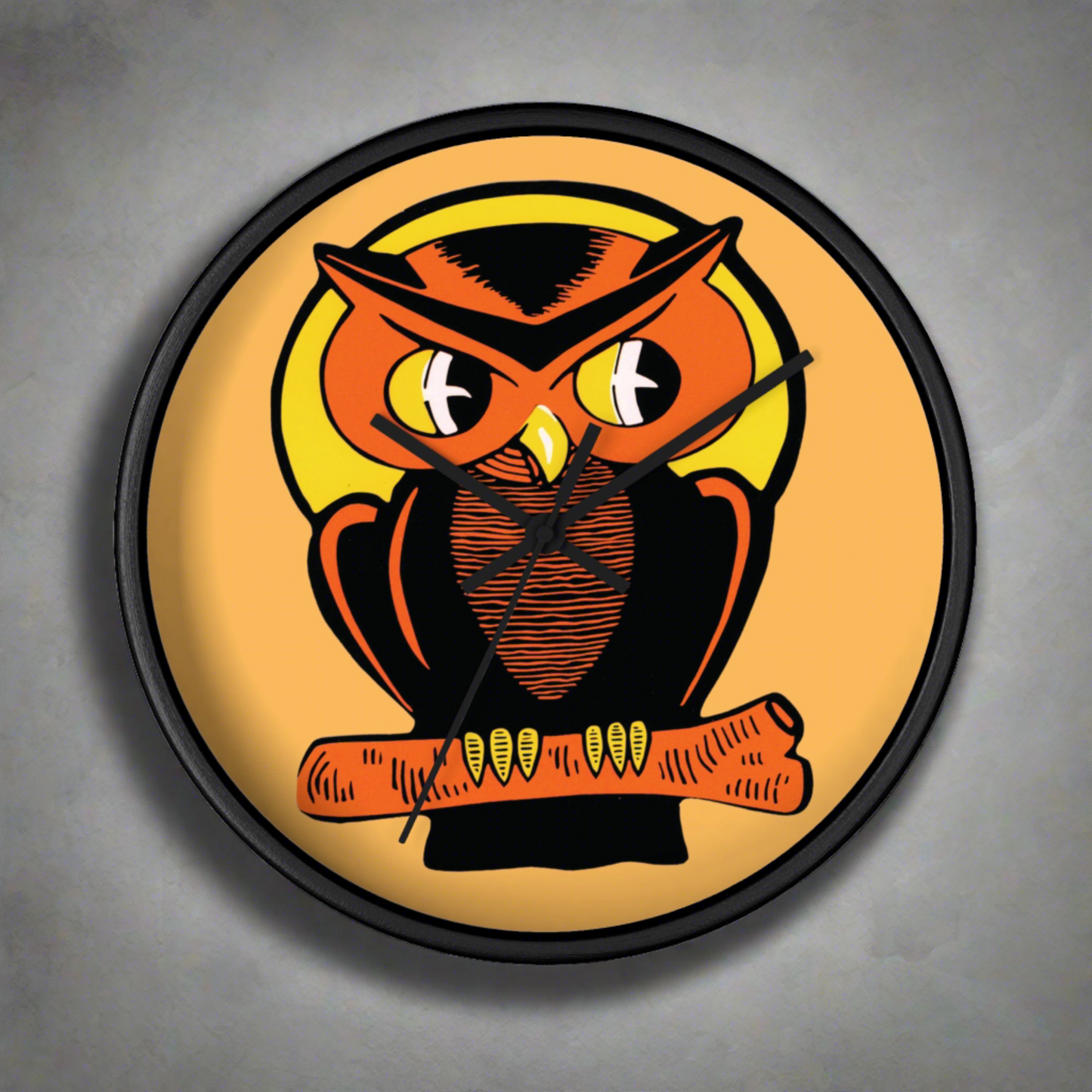 This black wooden wall clock features a retro illustration of an orange and black owl with a yellow full moon. The frame and hands of the clock are black.