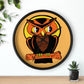 This black wooden wall clock features a retro illustration of an orange and black owl with a yellow full moon. The frame and hands of the clock are black.