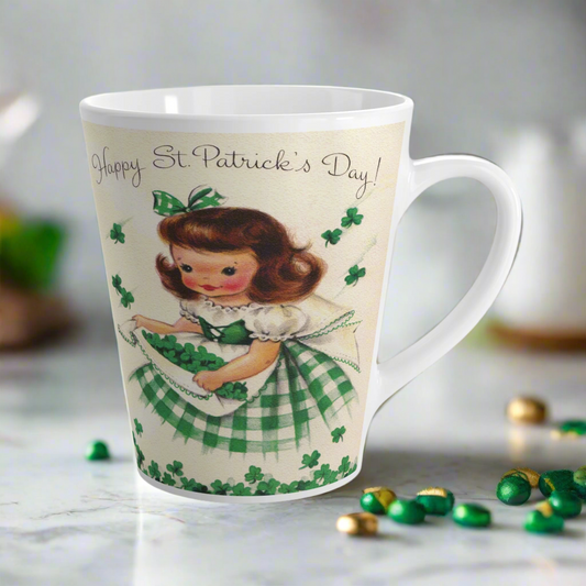 This ceramic latte mug features a vintage midcentury retro illustration of a girl gathering shamrocks.