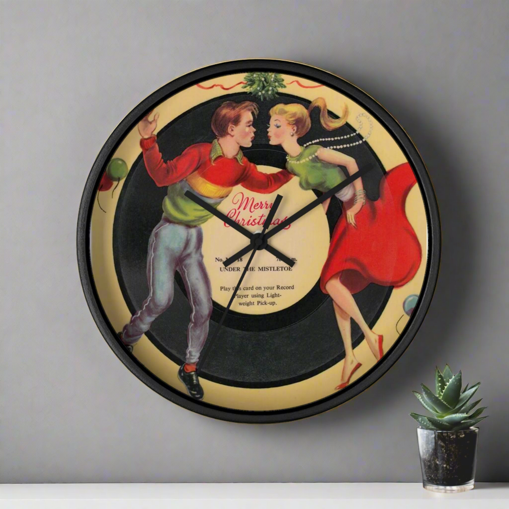 This round black wooden frame clock features a midcentury vintage print of a couple dancing under the mistletoe with a record that says Merry Christmas. Great for Christmas decoration or gifiting to your favorite couple.