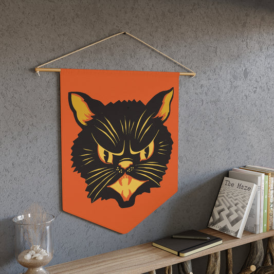 This orange fabric wall hanging pennant banner features a vintage Halloween Illustration of a beautiful black cat with orange and yellow eyes, nose, mouse and ears. The wall hanging comes with a wooden dowel and twine frame.