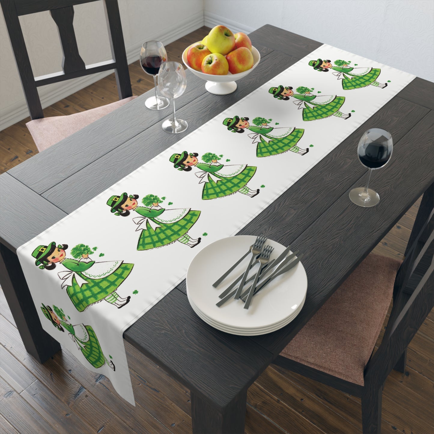 This table runner features a retro midcentury St. Patrick&#39;s Day illustration of a girl dressed in green, wearing a hat and holding shamrocks.