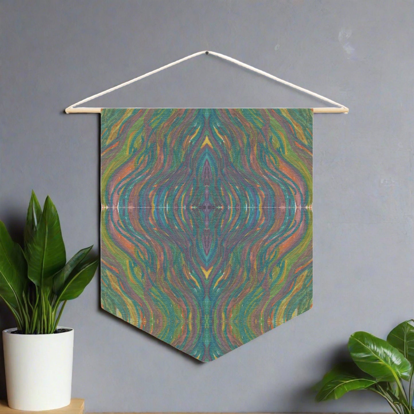 This fabric wall hanging by Caden Caraco features swirls of greens, yellows, blues, purples all blended.