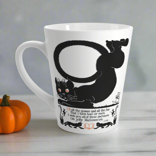 This 12 ounce glossy ceramic latte coffee mug features a vintage Halloween illustration of a black cat with a Halloween poem beneath him. There are smaller black cats, a book, owls and witches in the illustration as well.