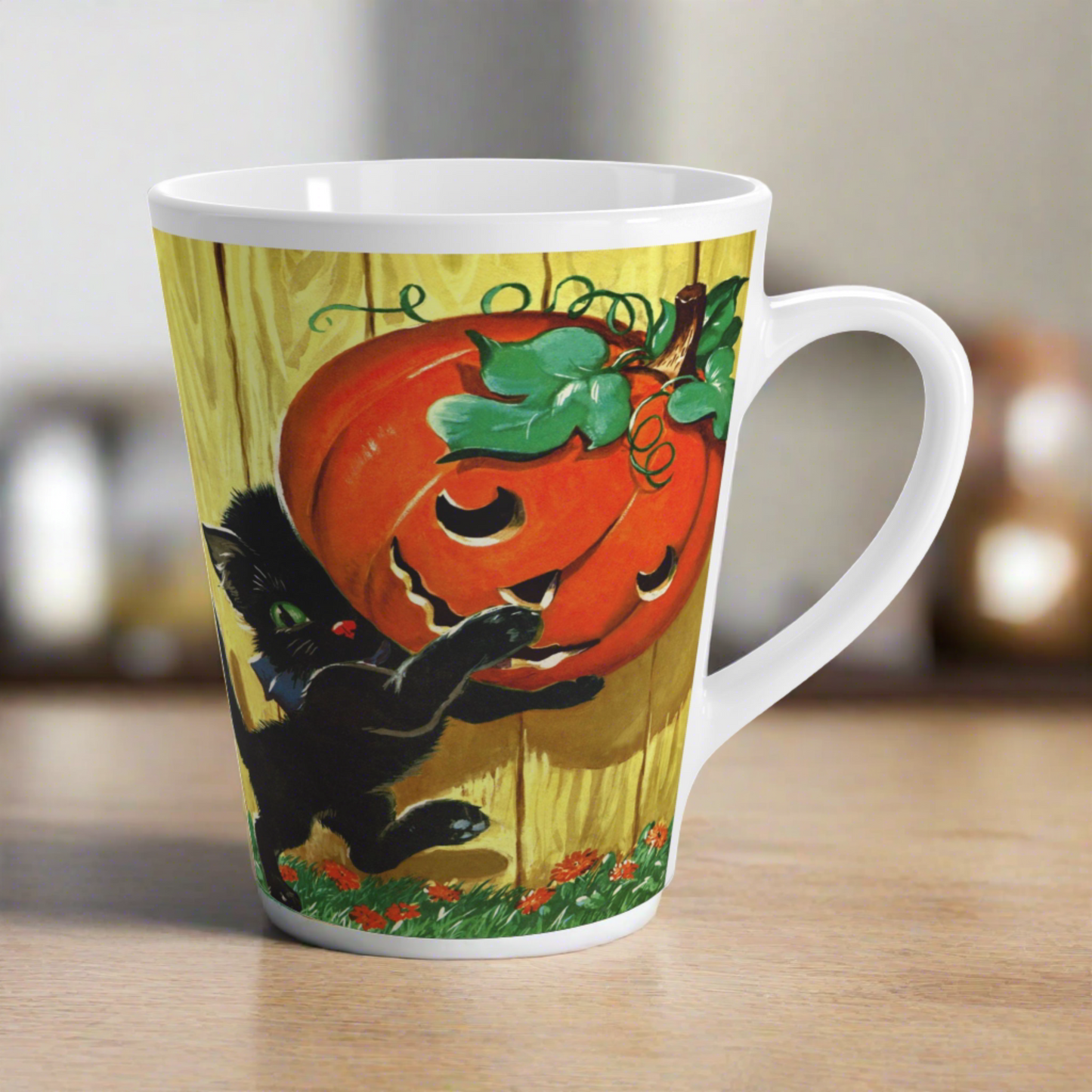 This glossy ceramic latte mug features a vintage Halloween illustration featuring a black kitty carrying a Jack 'o Lantern.