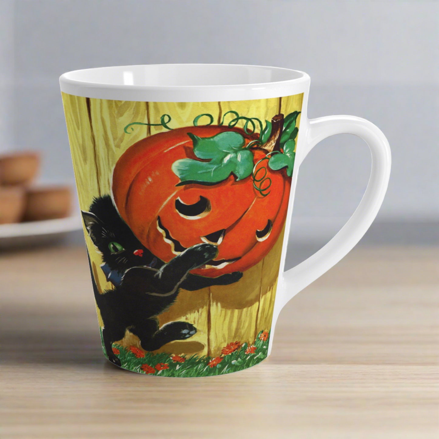 This glossy ceramic latte mug features a vintage Halloween illustration featuring a black kitty carrying a Jack 'o Lantern.