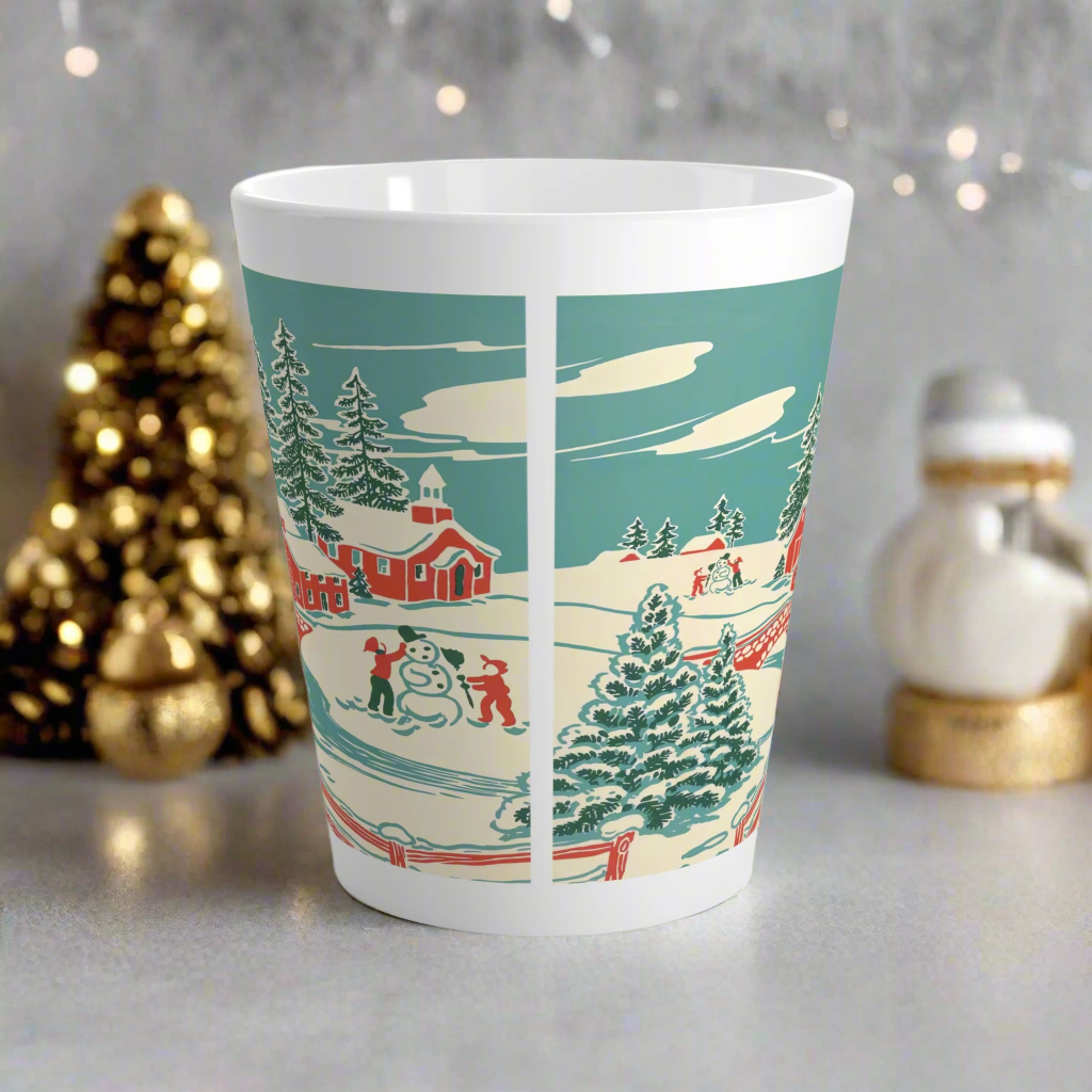 This ceramic glossy latte coffee mug features a vintage winter Christmas illustration of a snowy winter town. There are red houses, a bridge, trees, and two children building a snowman.