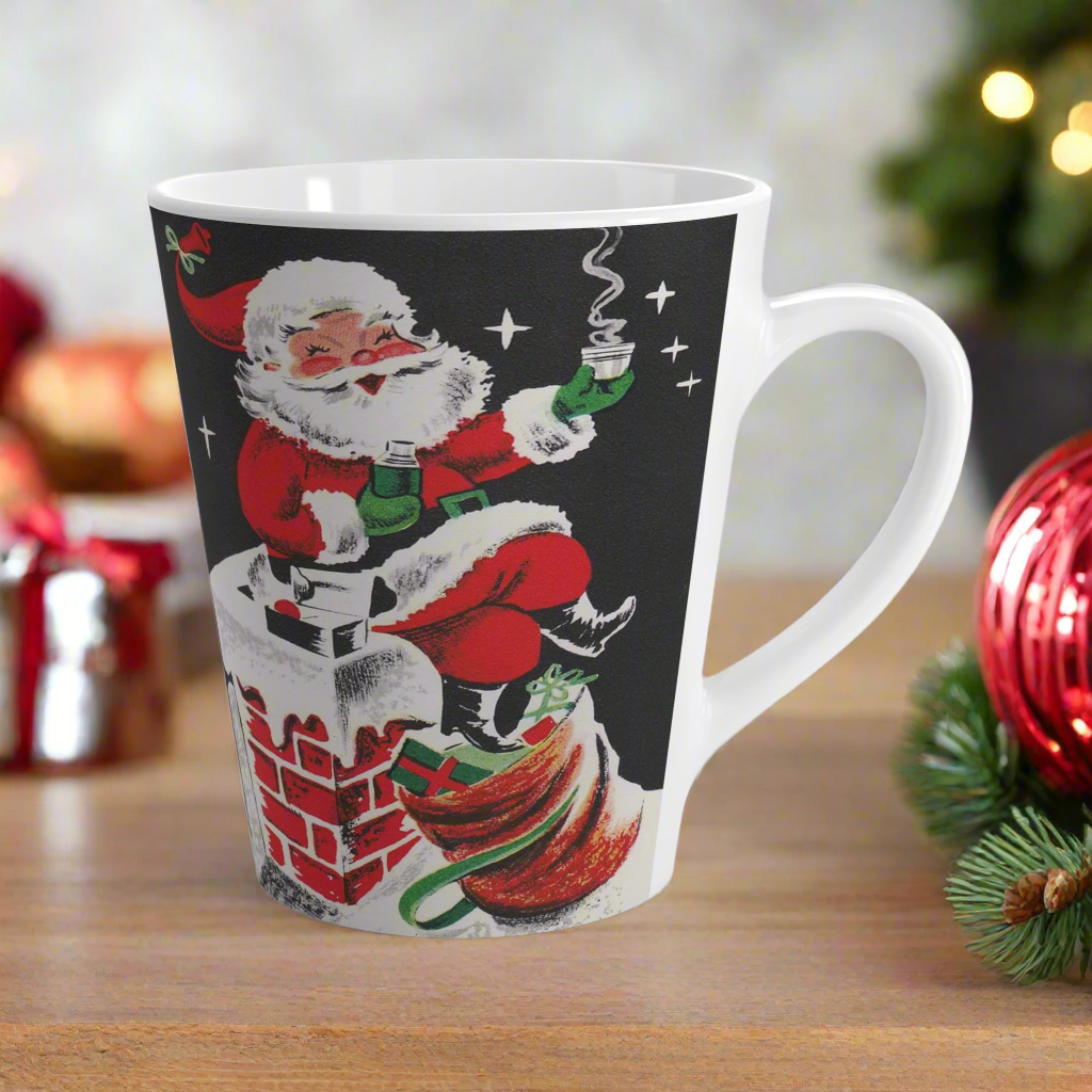 This ceramic glossy latte coffee mug features a midcentury retro Christmas illustration featuring a jolly Santa sitting on a brick chimney covered in snow. He has a sack of presents at his feet and is holding a thermos anda hot drink.