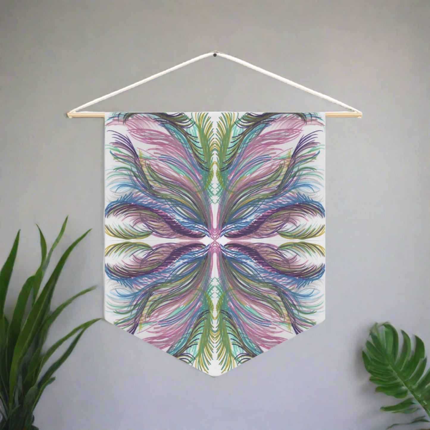 This fabric wall hanging features greens, blues, and purples inspired by the palm leaves of celestial Lyra. Artwork is by Caden Caraco. 