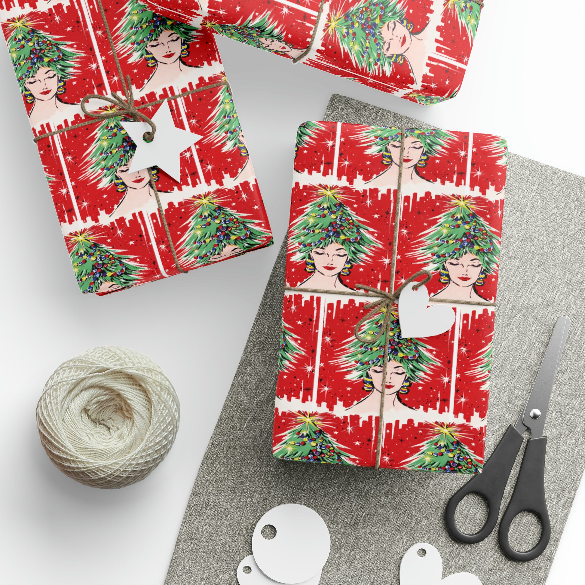 This festive Christmas gift wrap features a retro Midcenturyprint of a woman wearing a Christmas tree hat with a red background and black and white starbursts.