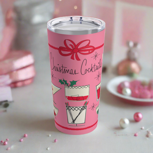 This 20 ounce pink travel tumbler features a midcentury retro design that says Christmas Cocktails featuring vintage style drinks and a red bow around the entire design.