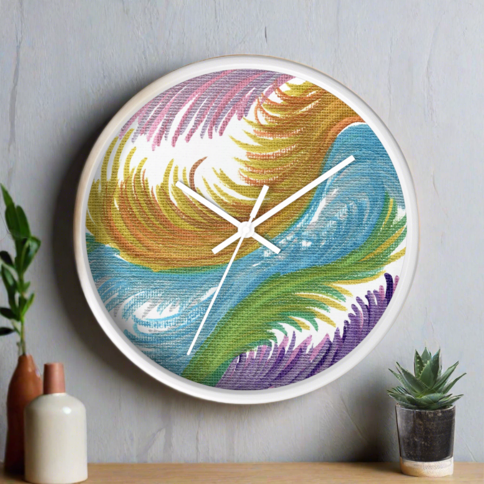 This white wall clock features the original artwork of Caden Caraco titled Space Feathers. Original medium is pen on canvas.  It features swirls in pink, purple, gold, blue and green.