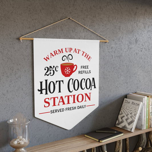 This white Christmas wall hanging banner flag says Warm Up At The Hot Cocoa Station Served Fresh Daily. Free Refills. It features a red cup.