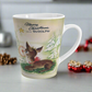 This ceramic latte coffee mug features a midcentury vintage Christmas illustration featuring Rudolph the Red Nosed Reindeer sitting down looking up at a gold star in the sky surrounded by snowy trees. It says: Merry Christmas Says Rudolph.