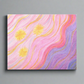 This canvas gallery wrap features the artwork of Caden Caraco. Original medium is oil pastels on paper. It features a celestial sunset of three yellow stars and a swirling sky full of pinks, purples, yellows and blues.