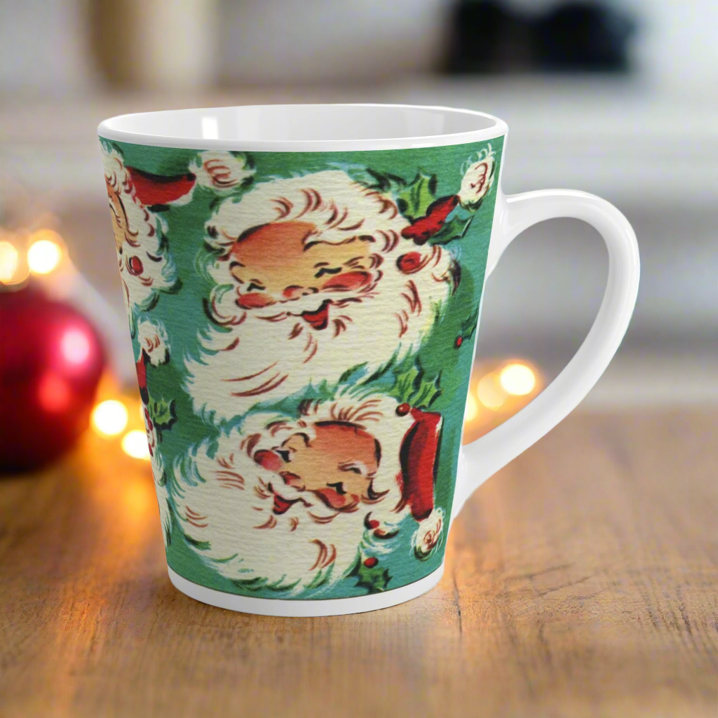 This ceramic glossy latte Christmas mug features a vintage Midcentury illustration of six laughing santas with holly berries.