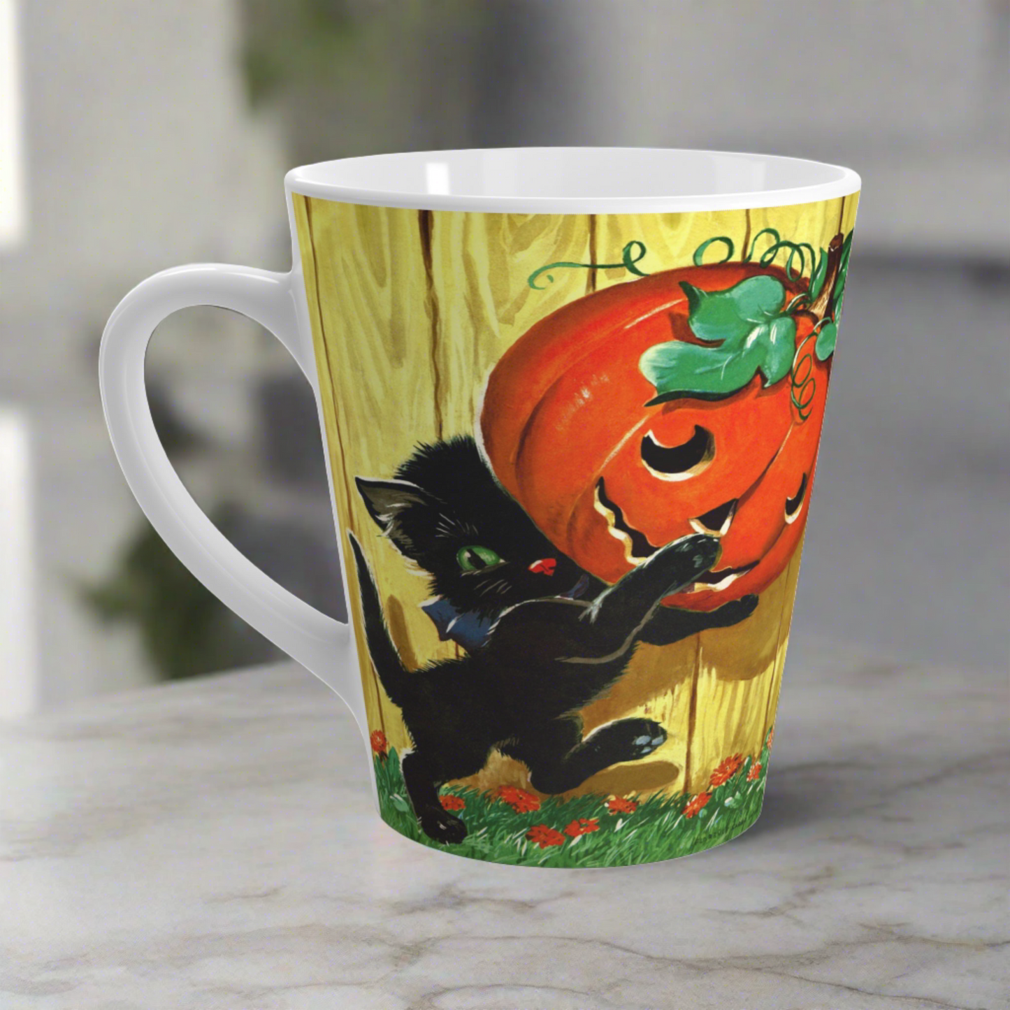 This glossy ceramic latte mug features a vintage Halloween illustration featuring a black kitty carrying a Jack 'o Lantern.