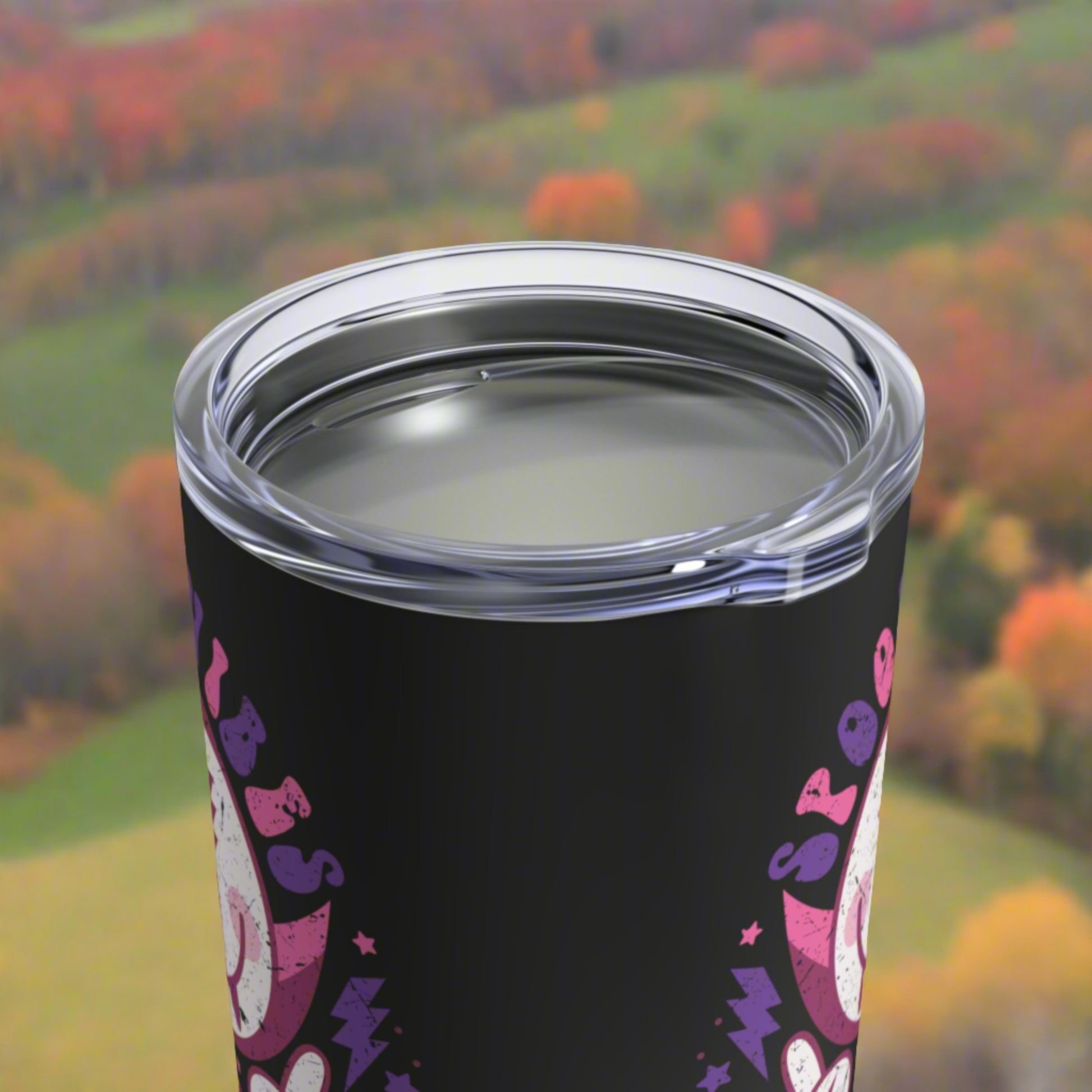 This 10 ounce stainless steel black travel tumbler mug features a distressed retro style illustration of Dracula and a bat that says Spooky Vibes.