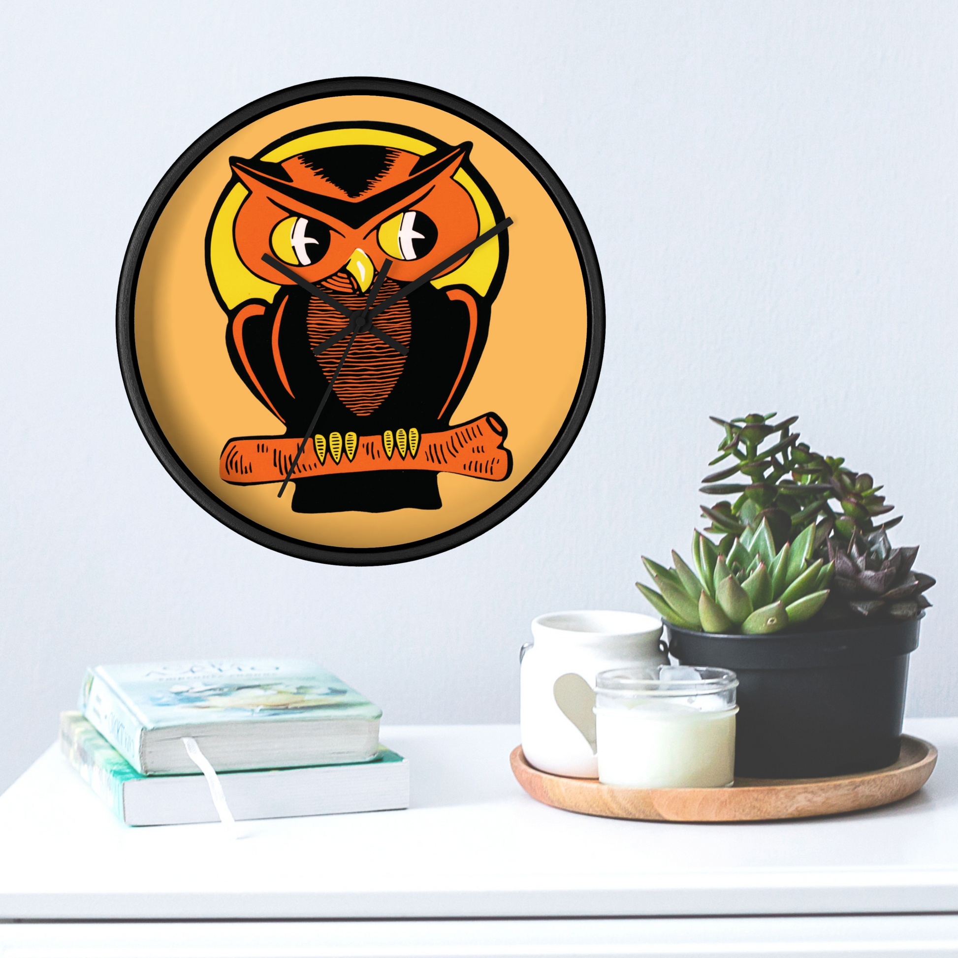 This black wooden wall clock features a retro illustration of an orange and black owl with a yellow full moon. The frame and hands of the clock are black.