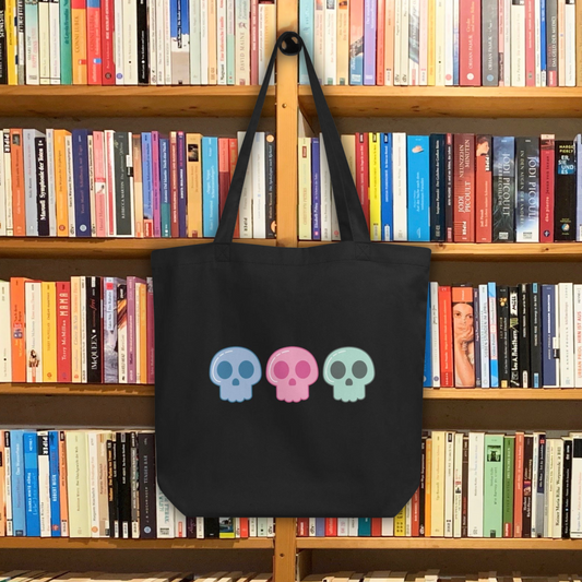 This large black eco cotton tote bag features cute pastel goth skulls in blue, pink and green.