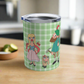 This 10 ounce travel tumbler mug features characters from the Sound of Music Lonely Goatherd song: The Goatherd, the girl in the pale pink coat, and the baby goat. The background is green plaid. The mug comes with a plastic sipping lid.