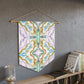 This fabric pennant wall hanging features the modern artwork of Caden Caraco. It features swirls of purple, greens and gold, inspired by Lyra and the memory of the universe. 