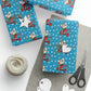 This Christmas gift wrap features a midcentury retro illustration of a cute mouse on a scooter wearing a Santa hat. The background is blue with white stars.