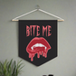 This pennant banner wall hanging features pink gothic lettering that says Bite Me with vampire lips and fangs dripping with blood beneath. 