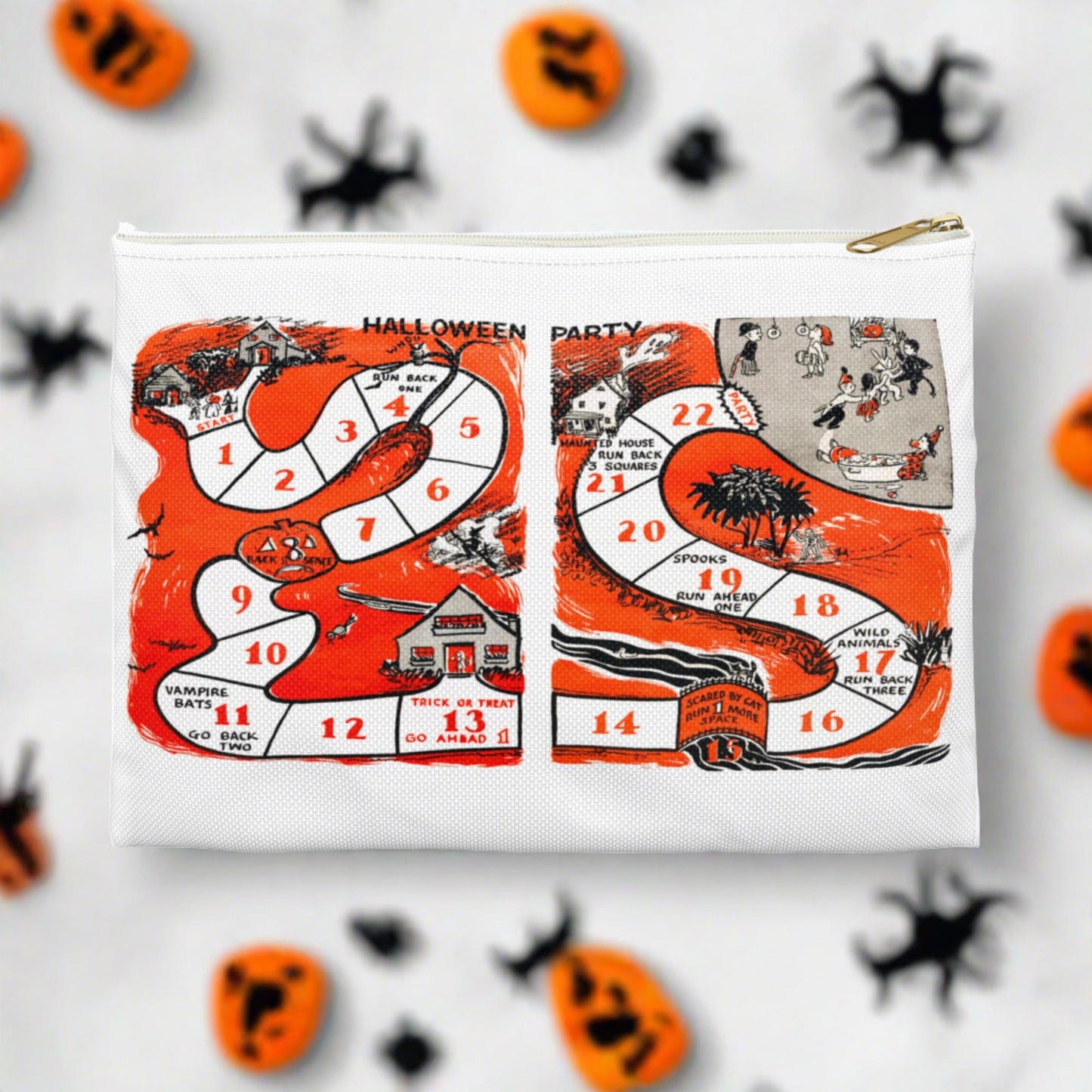 Halloween pouch travel bag. This white bag has a white zipper and gold puller. The design is a retro print of a Halloween Party Board game with adorable nostalgic artwork.