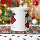 This white ceramic glossy coffee mug features two adorable kittens in red stockings at a Christmas mantle. The print is retro kitsch and says A Pair of Warm Wishes.