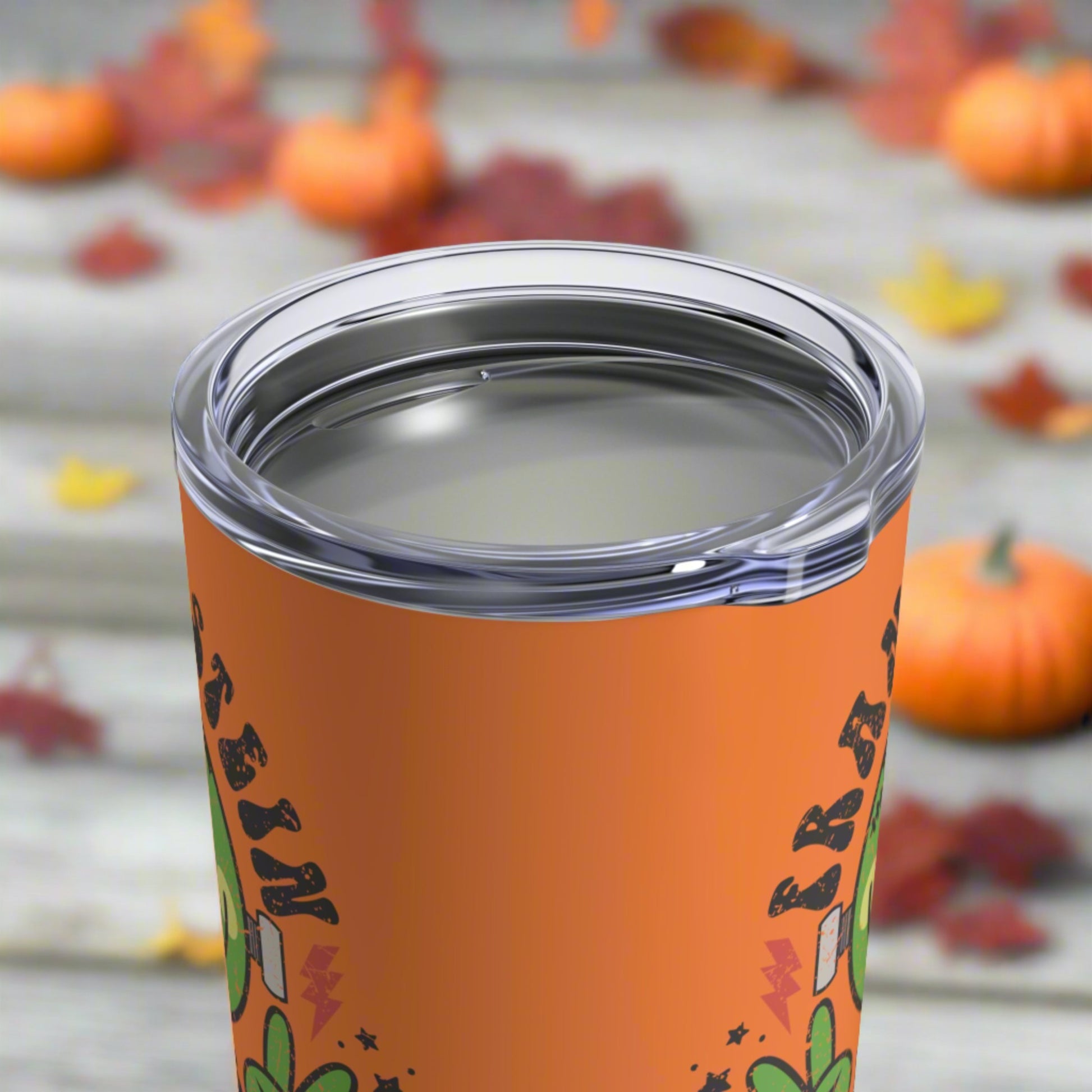 This 10 ounce orange stainless steel travel tumbler says Frankenstein Vibes and features a cute green monster smiley face with stars and lightning bolts.