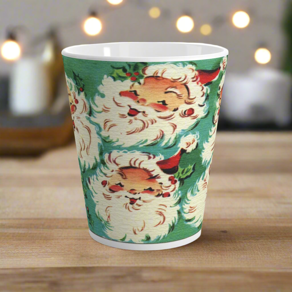 This ceramic glossy latte Christmas mug features a vintage Midcentury illustration of six laughing santas with holly berries.