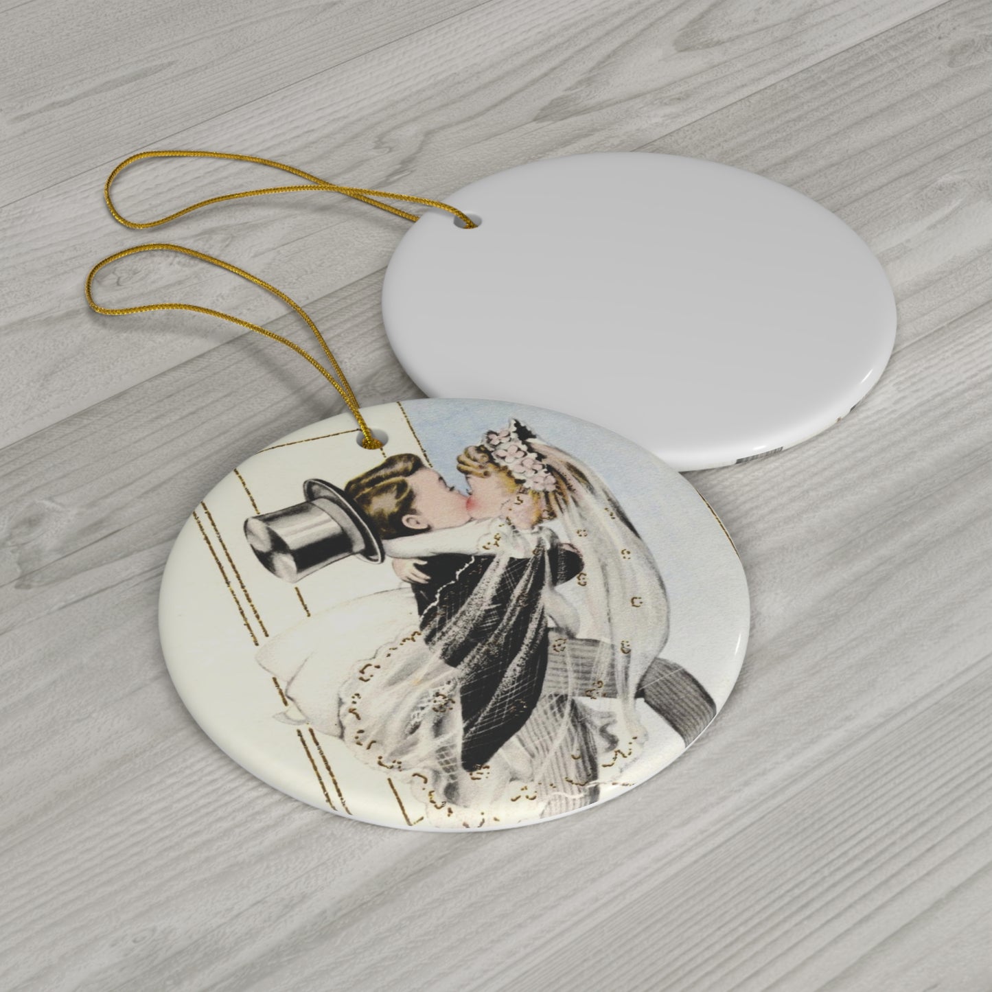 This round ceramic ornament features a vintage wedding illustration of a bride carrying his groom over the threshold while they share a kiss.