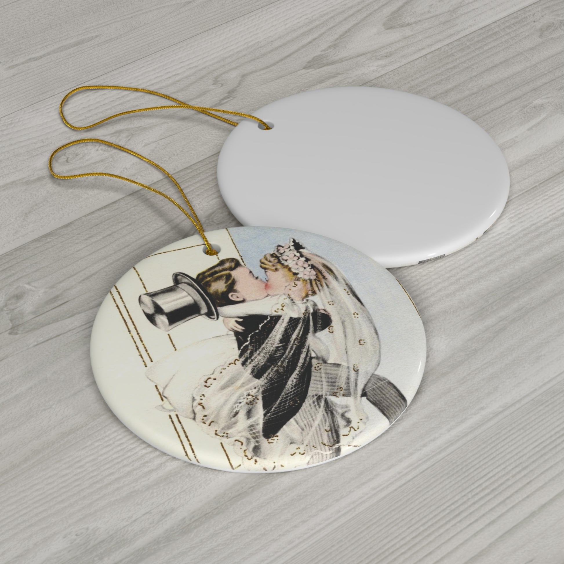 This round ceramic ornament features a vintage wedding illustration of a bride carrying his groom over the threshold while they share a kiss.