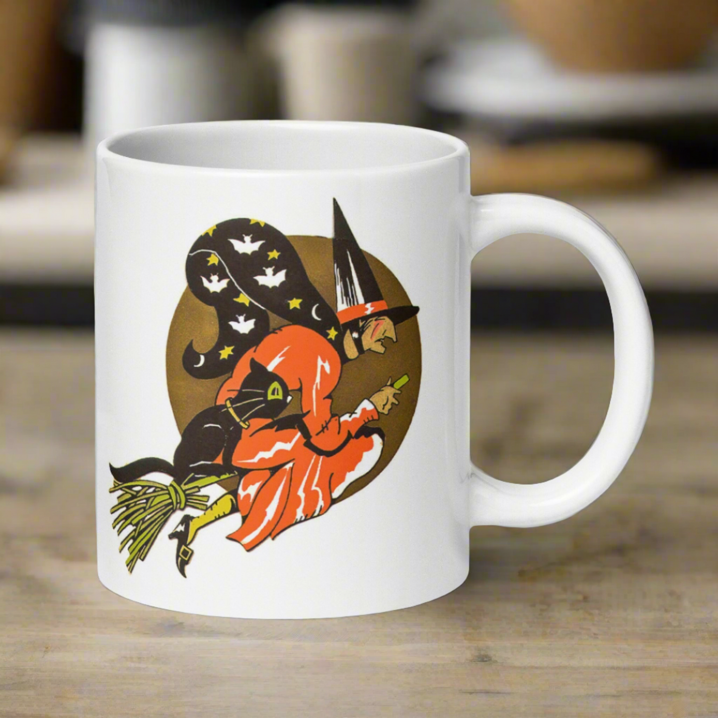 This ceramic glossy coffee mug features a retro vintage Halloween print of a witch flying on her broom with her black cat and a gold moon in the background.