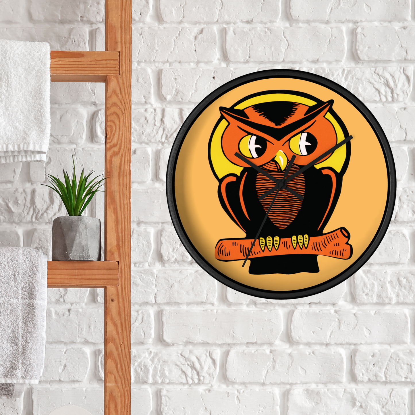 This black wooden wall clock features a retro illustration of an orange and black owl with a yellow full moon. The frame and hands of the clock are black.