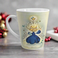 This ceramic glossy latte mug features an angel dressed in blue standing on a cloud. Her back is to us and you can see her wings. She is standing under a yellow star and bluebird. There are smaller white and blue stars and bluebirds surrounding her.