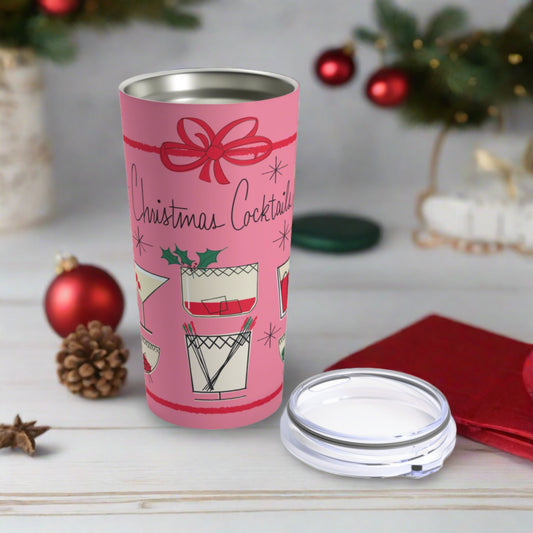 This 20 ounce pink travel tumbler features a midcentury retro design that says Christmas Cocktails featuring vintage style drinks and a red bow around the entire design.