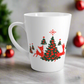 This ceramic glossy latte coffee mug features a midcentury retro illustration of red reindeer and green christmas trees with red ornaments.