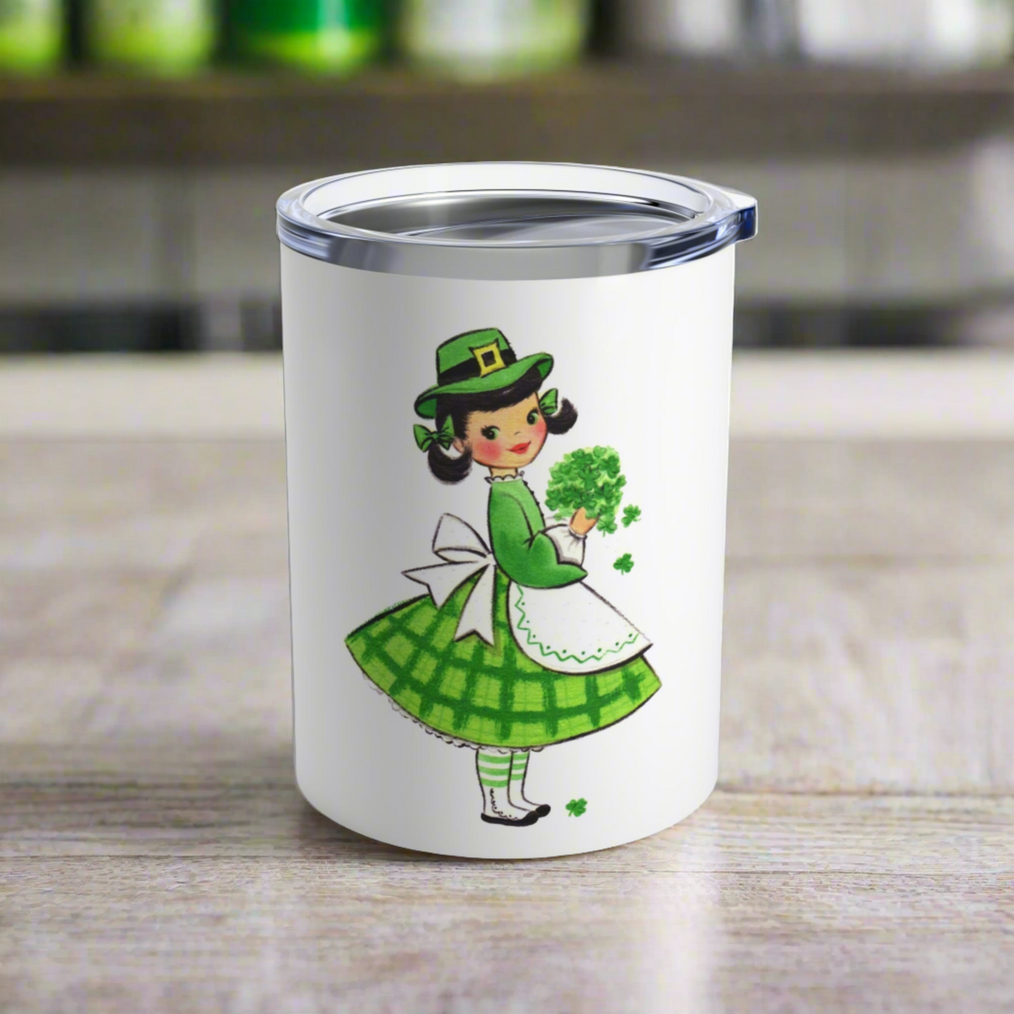 This 10 ounce stainless steel travel mug tumbler features a midcentury retro St. Patrick's Day illustration of an Irish girl holding a bouquet of shamrocks. 