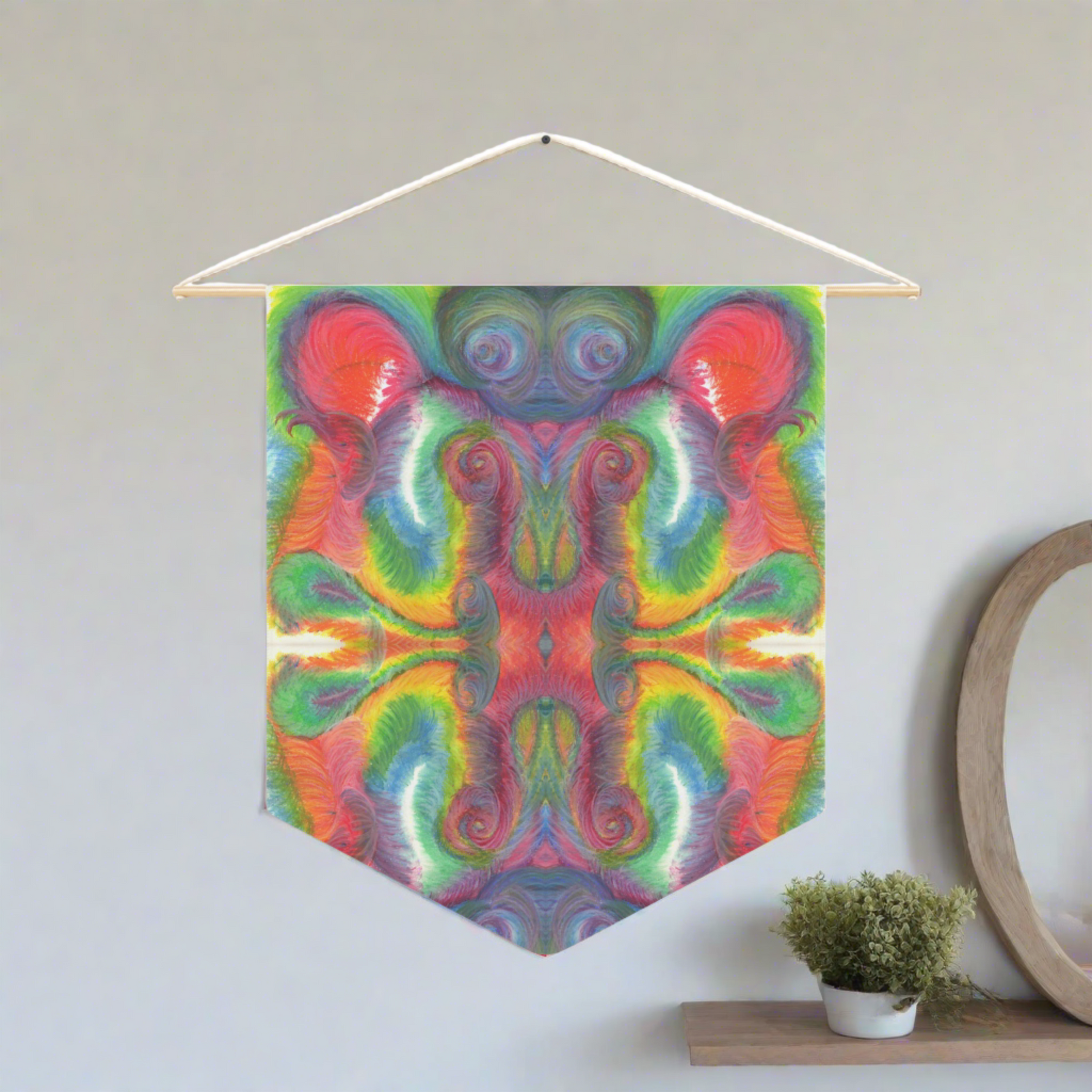 This fabric wall hanging features the hand drawn artwork of modern artist Caden Caraco. There are swirls of green, red, orange, yellows and purples. Original artwork is oil pastel on paper.