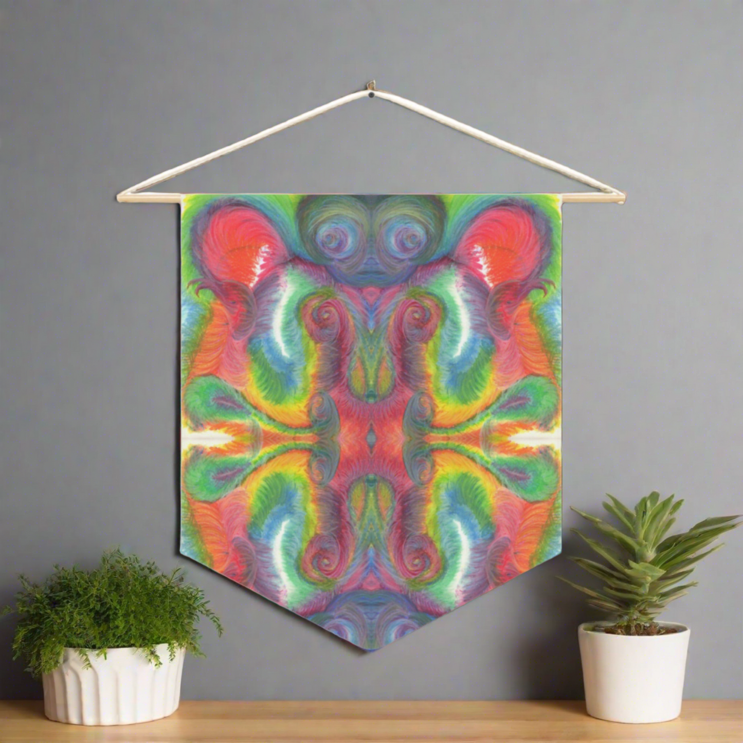 This fabric wall hanging features the hand drawn artwork of modern artist Caden Caraco. There are swirls of green, red, orange, yellows and purples. Original artwork is oil pastel on paper.