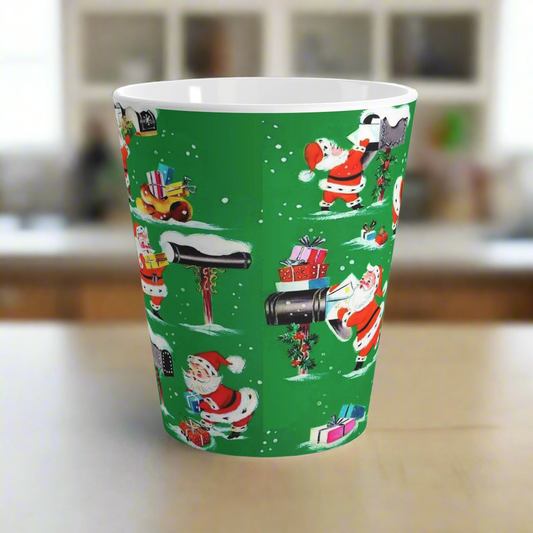 This glossy latte mug features retro Midcentury vintage Christmas wallpaper of Santa in the snow delivering presents at different mailboxes.