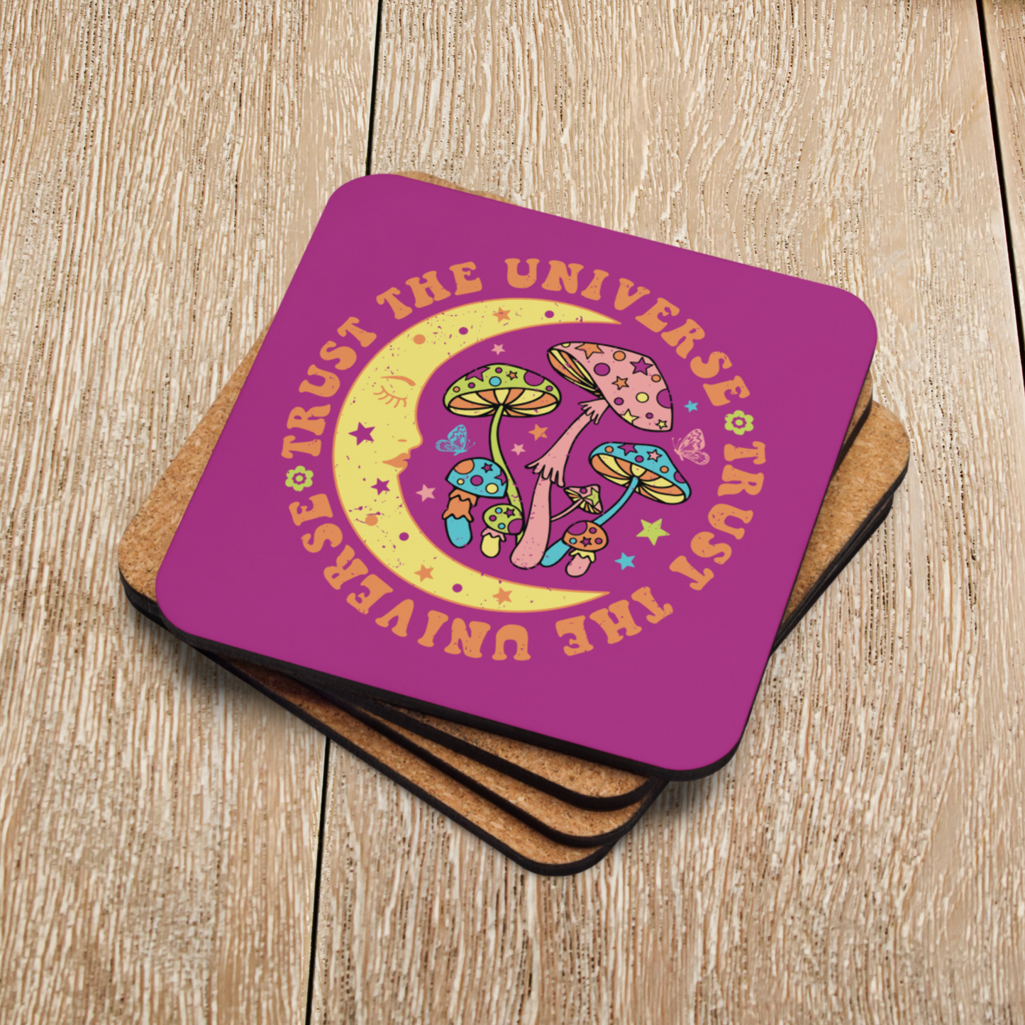 This glossy cork-back coaster says Trust The Universe in a retro style font. The coaster features the moon, mushrooms, stars, and butterflies.