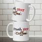 The ceramic white glossy mug features atomic era lettering that says Fresh HOT Coffee with starbursts around the word coffee. Fresh lettering is black, HOT is in red, and coffee is brown with a black shadowing.