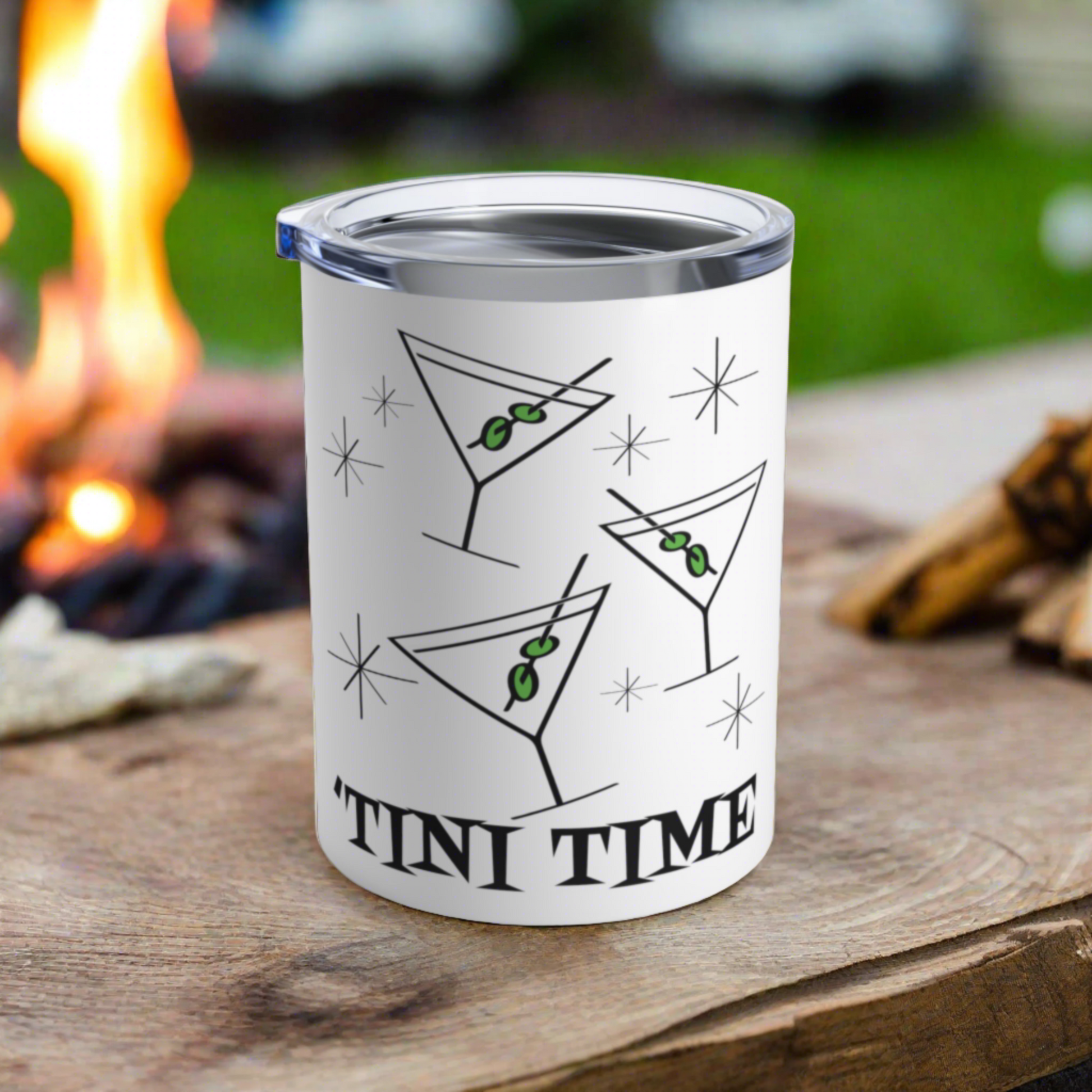 This 10 ounce white stainless steel tumbler features three martini glasses with green olives on toothpicks surrounded by stars and at the bottom the words say Tini Time in Atomic Retro Style lettering.