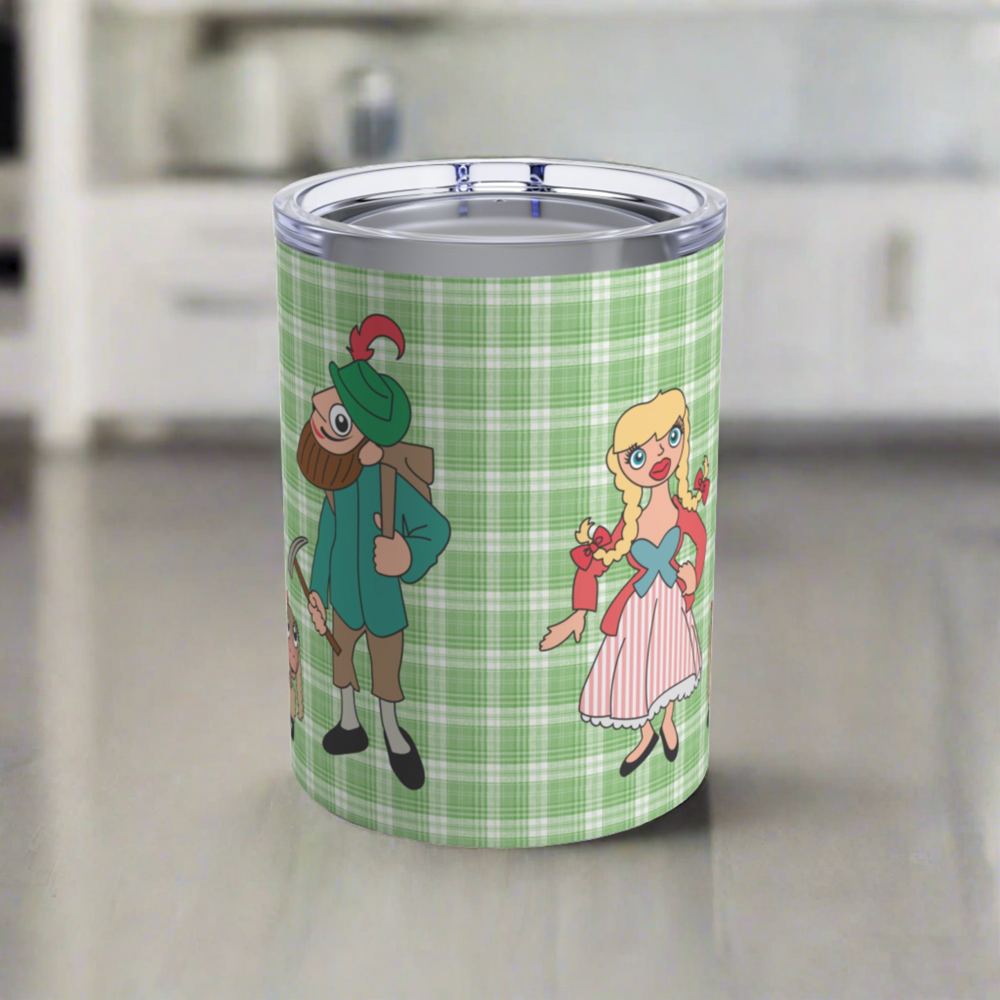 This 10 ounce travel tumbler mug features characters from the Sound of Music Lonely Goatherd song: The Goatherd, the girl in the pale pink coat, and the baby goat. The background is green plaid. The mug comes with a plastic sipping lid.